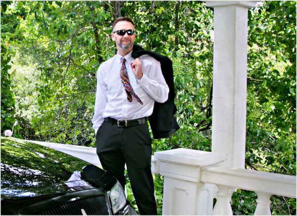 Outdoor casual professional portraits of a man with his car