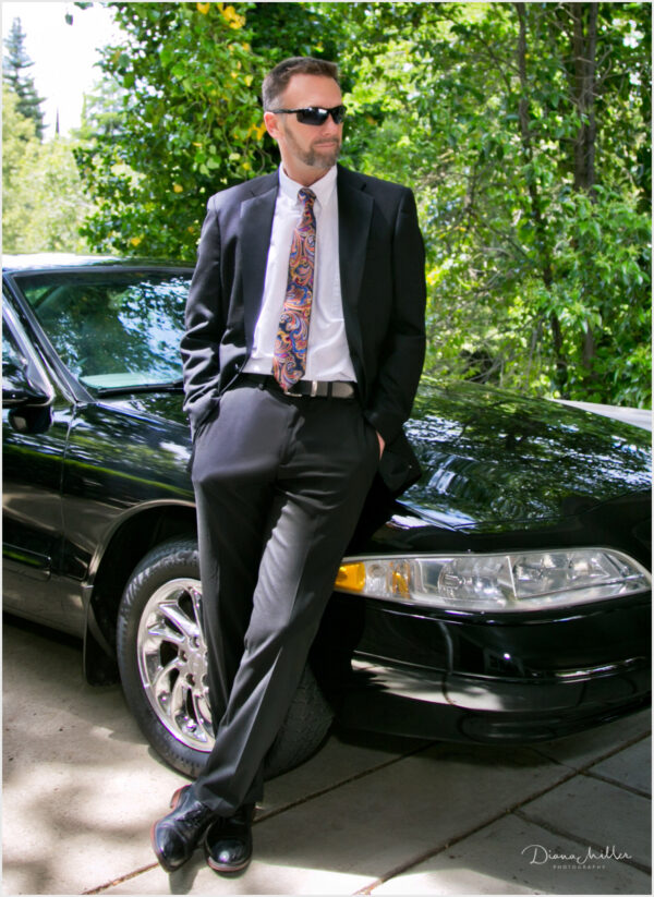 Outdoor casual professional portraits of a man with his car
