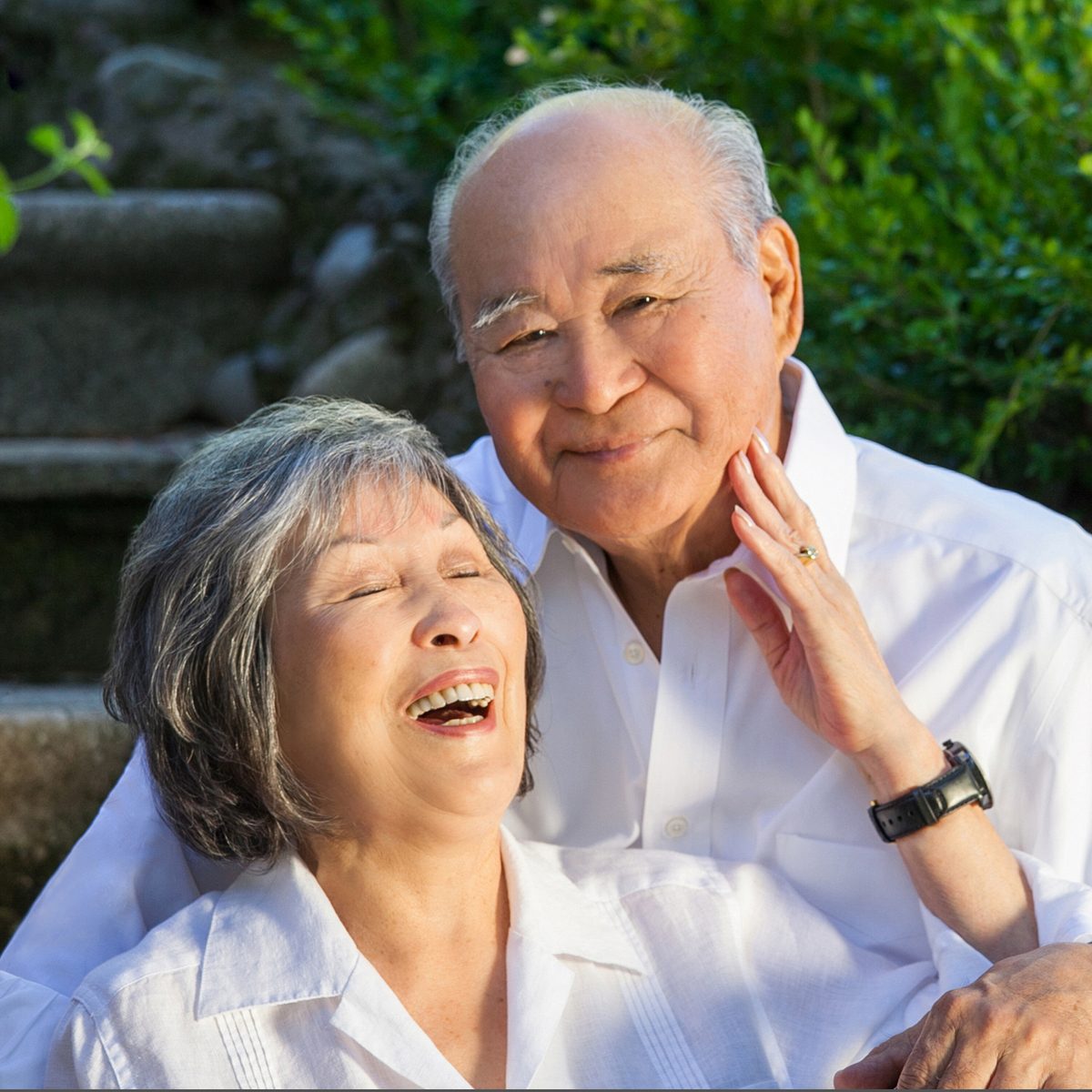 Asian Senior Citizen couple outside portrait