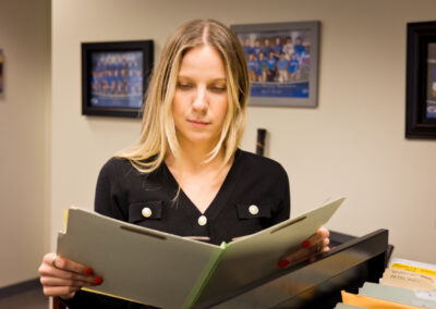 Woman looking at files in a law office in Sacramento