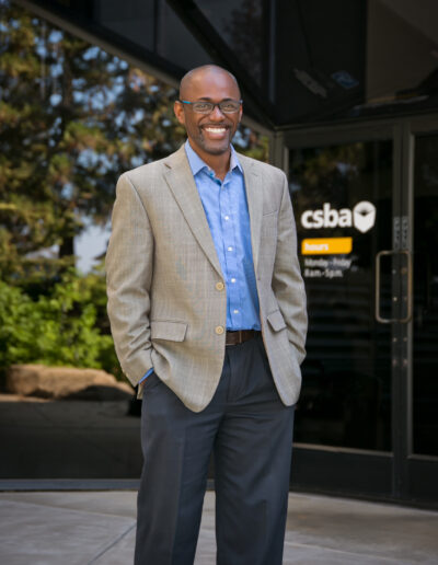 Portrait of an African American man outside the CSBA building in Sacramento